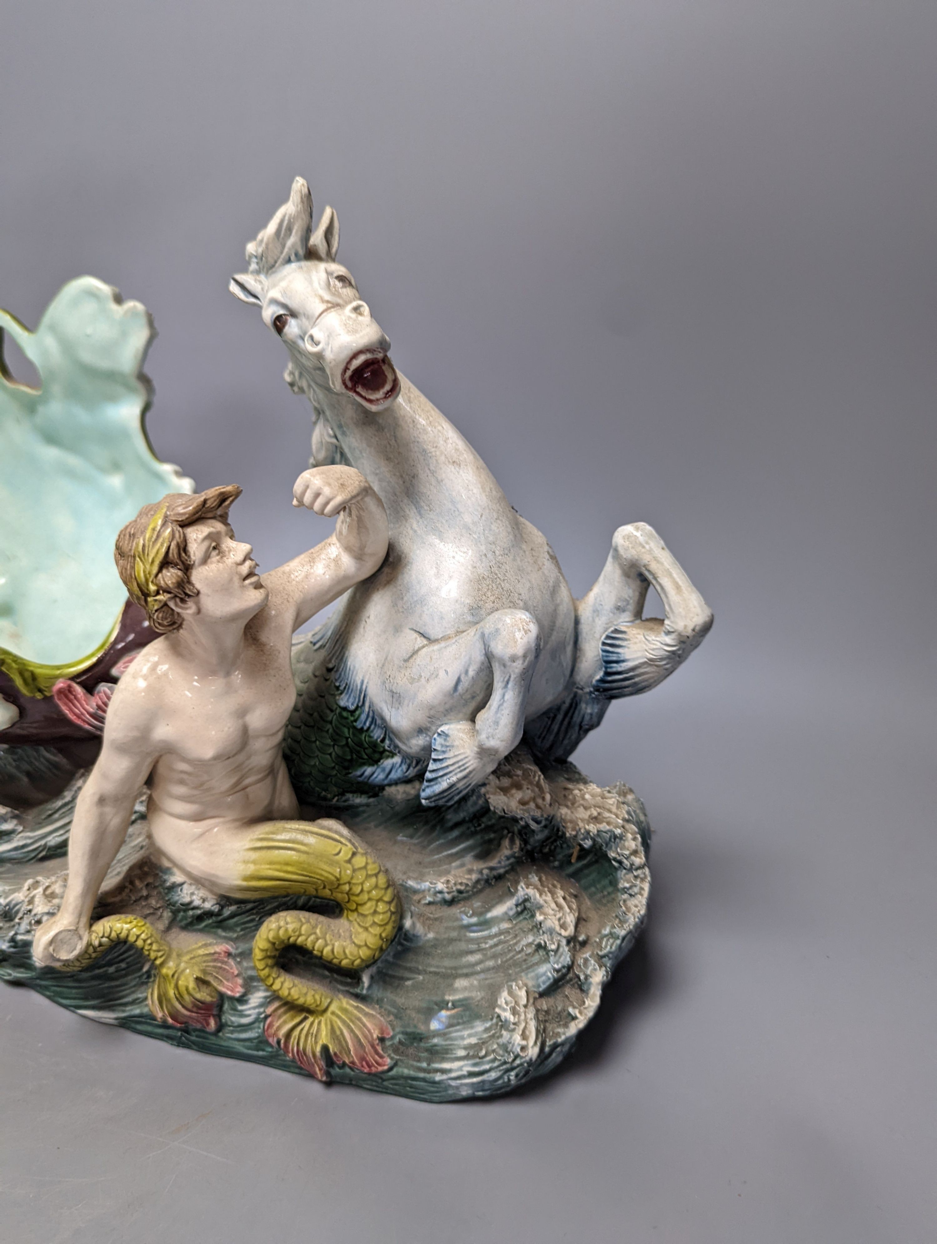 An Austrian or German majolica Triton and nymph figural centrepiece bowl, 39cm tall